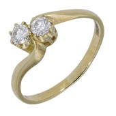 A diamond two stone ring, the brilliant-cut diamonds between crossover shoulders, mounted in 18ct gold, UK hallmark,...