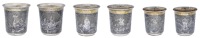 Three matching  Russian silver and niello beakers, reserving oval panels of a hunting scene, a statue of Peter the...