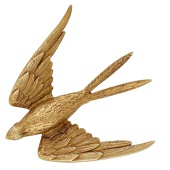 An 18ct gold swallow brooch, 1984, realistically modelled and textured, with brilliant-cut diamond eyes, London...