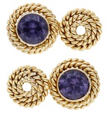 A pair of gem-set cufflinks, each of the ropetwist mounts collet-set with a circular-cut synthetic colour change...