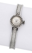 Luxor. A lady’s white gold and diamond-set bracelet watch, circa 1960.
Movement: manual winding.
Dial: silvered,...