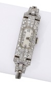 Cyma. A lady’s platinum and diamond-set Art Deco cocktail watch, circa 1930.
Movement: manual winding, 15...