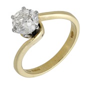 A diamond ring, the brilliant-cut diamond in a raised six-claw setting, within crossover mount, mounted in 18ct...