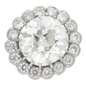 A diamond cluster jewel, the old brilliant-cut diamond, weighing 2.75 carats, within a surround of similarly-cut...