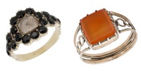Two early 19th century memorial rings, the first with glazed hairwork panel within a cluster surround and shoulders...