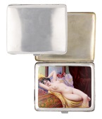 A German silver cigarette case with concealed erotic scene, the plain exterior enclosing an enamelled panel...