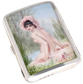 A silver cigarette case, of bowed rectangular form, the enamel scene depicting a young naked woman at the water’s...