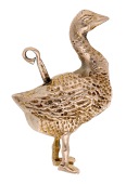 A 9ct gold novelty charm, the realistically modelled goose laying an egg, with sliding bale mechanism, London...