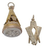 Two 9ct gold masonic fobs, the first with engraved hardstone seal in a gold mount formed of masonic motifs including...