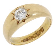 An 18ct gold and diamond single stone ring, 1899, the tapered band bezel-set with an old-brilliant-cut diamond in a...