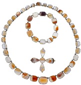 An early 19th century agate suite, the rivière necklace set with a graduated row of cushion-shaped agate panels in...