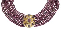 A multi-strand garnet necklace with antique gold clasp, circa 1830, the 10 rows of garnet beads with vertical spacer...