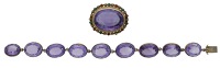 A 19th century amethyst brooch and bracelet, the brooch comprising an oval mixed-cut amethyst collet-set within a...