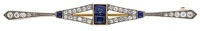 An early 20th century sapphire and diamond bar brooch, of tapering form and set with step and trapezoid-cut...