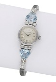 Movado. A lady’s gold, aquamarine and diamond-set cocktail watch, circa 1950.
Movement: manual winding, 17...