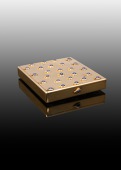 A gold and sapphire vanity case by Cartier, circa 1920, of rectangular form, set to the front and base with...