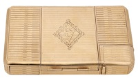 A 9ct gold necessaire by Dunhill, 1936, of rectangular form, with ribbed decoration throughout, comprising a hidden...