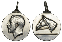 Uncertain, a silver medallet by Mappin and Webb, bust of George V left, rev. horse’s head left, Liver Bird(?) on...