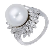 A cultured pearl and diamond ring, the cultured pearl, measuring approximately 11.6mm, within a wraparound surround...