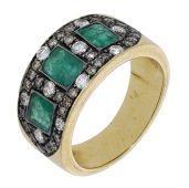 An emerald and diamond ring, the tapered band set with three step-cut emeralds, within a surround pavé-set with...