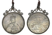 INDIA, 1909, an engraved silver presentation medal. unsigned, half-length portrait of Edward VII, crowned and robed,...