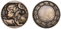 FRANCE, Fame, c. 1935, an Art Déco bronze award medal by M. Delannoy, head of Fame left, blowing trumpet and...