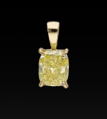 A Fancy coloured diamond pendant, the cushion-shaped diamond of yellow tint, weighing 2.01 carats, in a four claw...