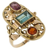 A gem-set ring, possibly German, the oval openwork panel of foliate design and set with a step-cut green tourmaline,...