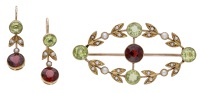 A gem-set suite, circa 1900, the lozenge-shaped brooch set with a circular-cut almandine garnet with similarly-cut...