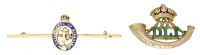 Two Regimental brooches, the first a Durham Light Infantry green and red enamelled brooch, the second a Royal Corps...