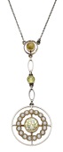 An early 20th century pendant, the principal circular-cut yellow sapphire within a seed pearl target surround, below...