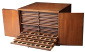 The Johnson cabinet: A mahogany coin cabinet by Swann, 33 x 30 x 26cm, comprising 20 trays uniformly double-pierced...