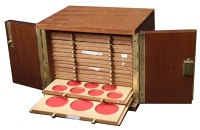19th Century Tokens, The Brecker cabinet: A wooden coin cabinet by St Leonards, 22.5 x 17.5 x 18cm, comprising 14...