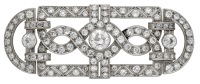 An Art Deco diamond brooch, the openwork plaque with entwined scroll and pierced zig-zag detailing, set throughout...