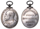 Territorial Force Efficiency Medal, a silvered-bronze medal by G.W. de Saulles, uniformed bust left, rev....