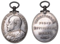 Territorial Force Efficiency Medal, a silvered-bronze medal by G.W. de Saulles, uniformed bust left, rev....