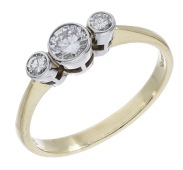 A diamond three stone ring, set with a graduated row of brilliant-cut diamonds in 18ct gold, UK hallmark, total...