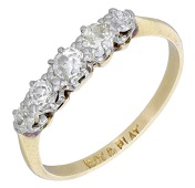 A diamond five stone ring, set with a graduated row of old brilliant-cut diamonds, to a plain polished hoop, stamped...