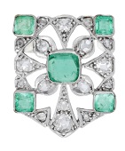 An emerald and diamond brooch, converted from an Art Deco jewel, of openwork design and set with step-cut emeralds,...