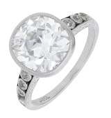 An early 20th century diamond ring by Jabel, the cushion-cut diamond, weighing 3.85 carats, in a rubover setting...