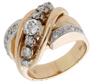 A diamond ring, circa 1950, the tapered band of stylised crossover design and set with old brilliant and rose-cut...