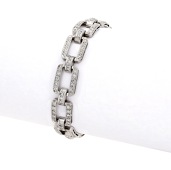 An Art Deco diamond bracelet, the openwork panels set throughout with single-cut diamonds, mounted in platinum,...