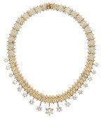 A diamond fringe necklace, the mesh-link neck chain with polished flowerhead motifs and suspending a knifewire...