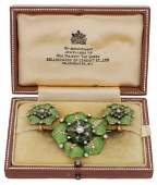 An enamel and diamond flower brooch and ear clips, each modelled as a flower with green guilloché enamel petals and...