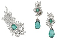 An antique emerald and diamond brooch and ear clip suite, the stylised feather set throughout with old brilliant and...