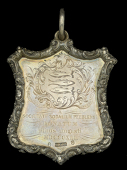 An attractive Society of Members of Peebles School Prize Shield, 61mm x 52mm, silver, with Georgian hallmarks for...