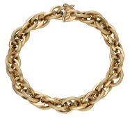 An 18ct gold bracelet by Filippini Fratelli, circa 1965, the fancy cable-link chain with alternating reeded and...