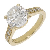 A diamond ring, set with a brilliant-cut diamond between shoulders set with similarly-cut diamonds, stamped...