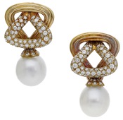 A pair of interchangeable ear clips by Illario, composed of detachable and interlocking triangular hoops, one...