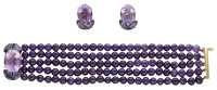 A gem-set bracelet and earring suite by Deakin & Francis, 1986, the five rows of amethyst beads to an oval-cut...